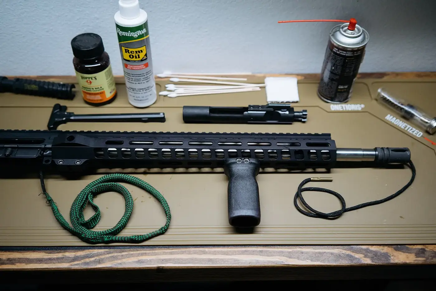 Rifle cleaning bench with bore snake, solvent, oil, swabs and cleaning tools