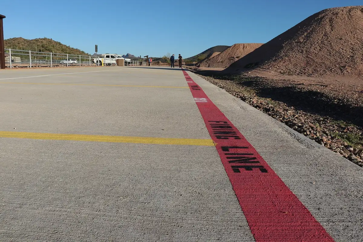 Concrete firing line at a BLM recreational shooting site in the Arizona desert
